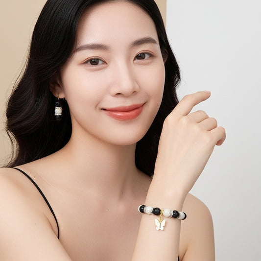 Elegant Black & White Beaded Bracelet and Earring Set with Golden Butterfly Charm