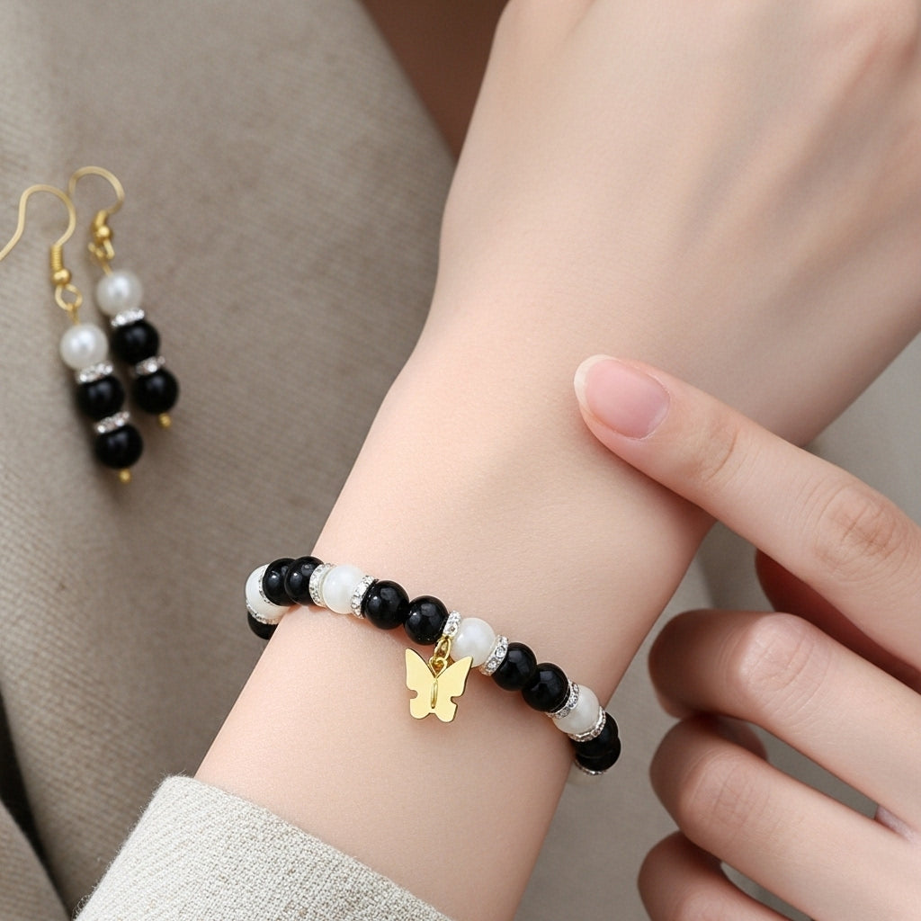 Elegant Black & White Beaded Bracelet and Earring Set with Golden Butterfly Charm