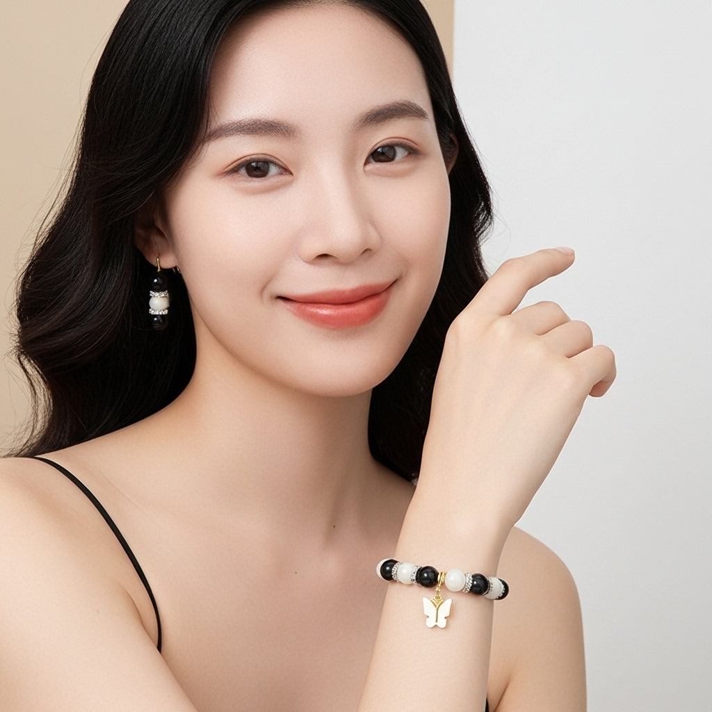 Elegant Black & White Beaded Bracelet and Earring Set with Golden Butterfly Charm
